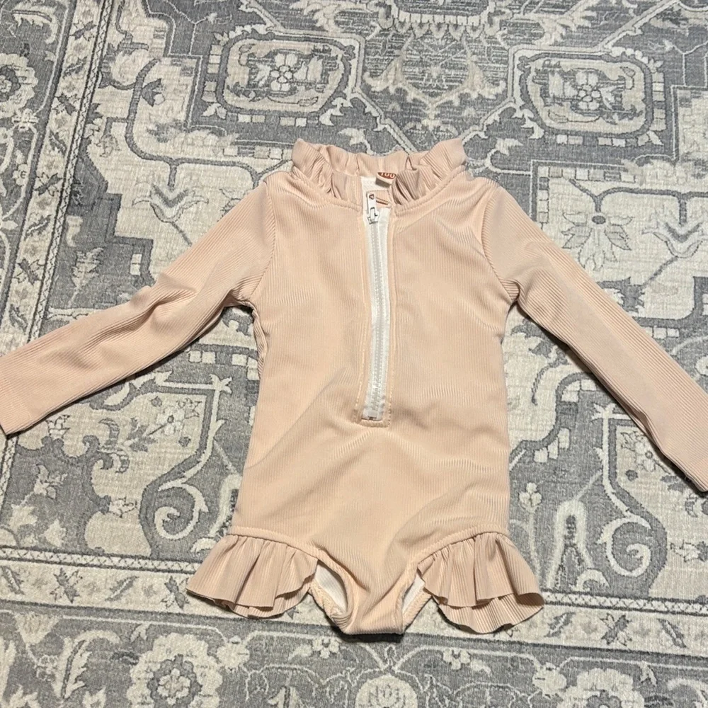 Ruffled cream color Kids One Piece swimsuit. Girls size 100